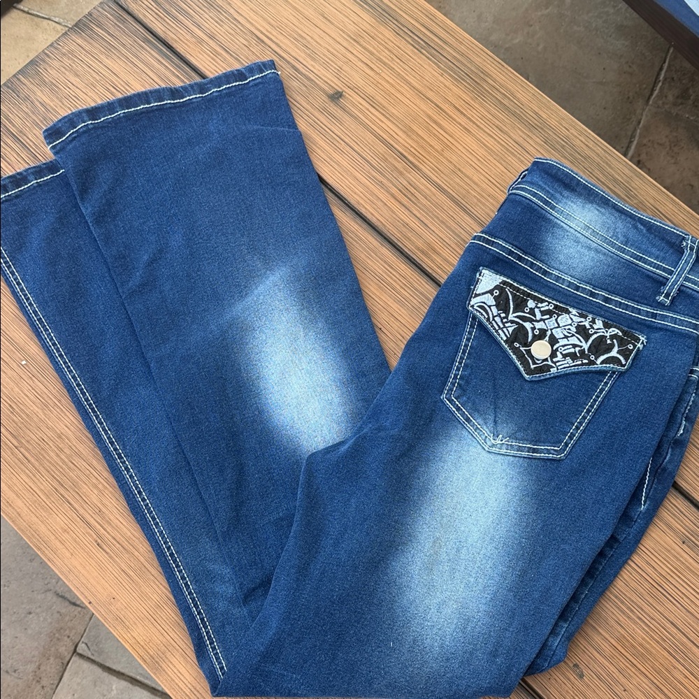 Women’s Blue Washed Denim Jeans with Embellished Pocket